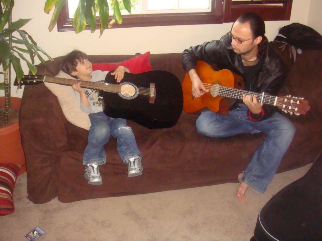 Playing guitar on the couch with family